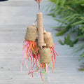 Colourful shredded paper bird chewing toy made from natural wood and sisal rope for parrots