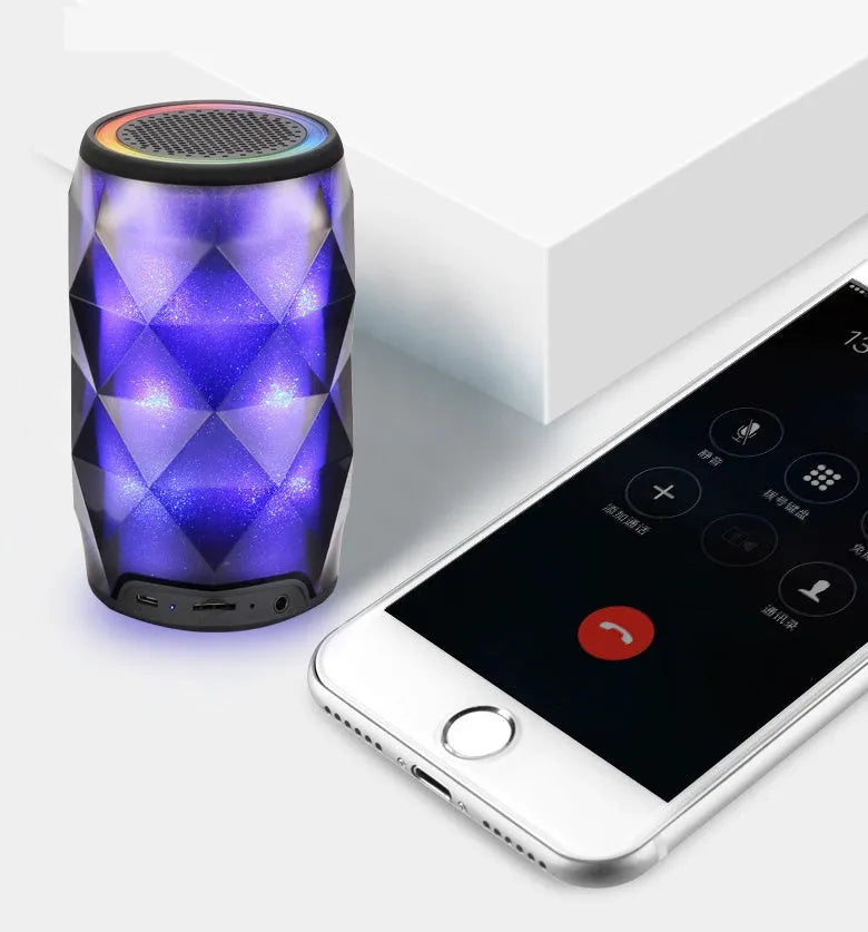 Black crystal diamond-cut Coke can shaped Bluetooth speaker with colourful lighting effects.