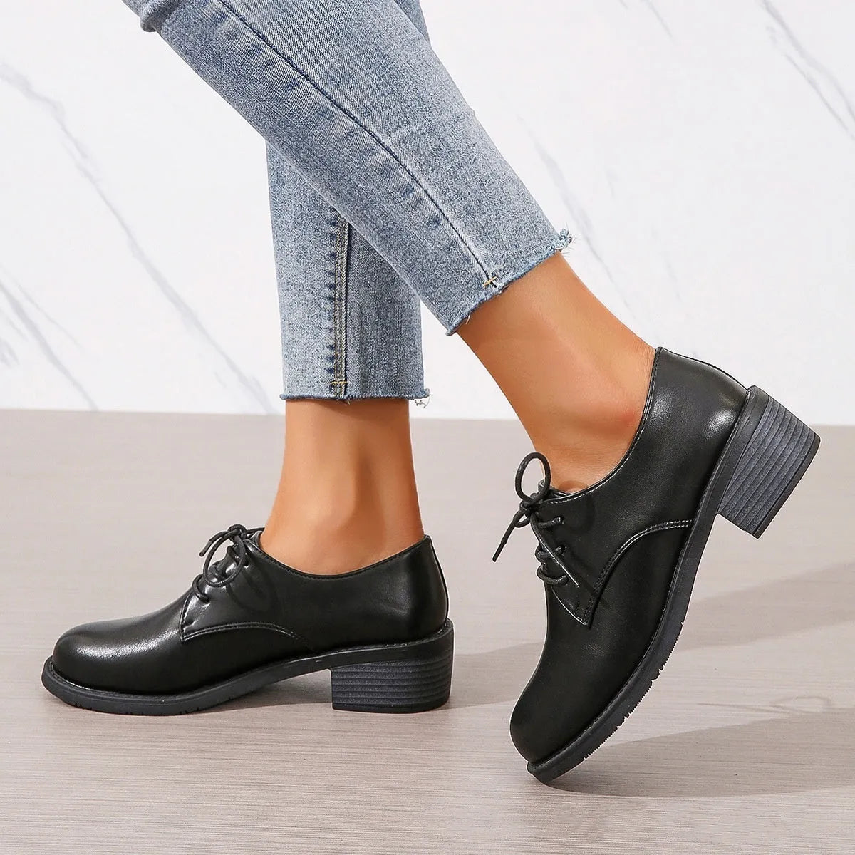 Black women's chunky heel ankle boots with rubber sole and professional styling