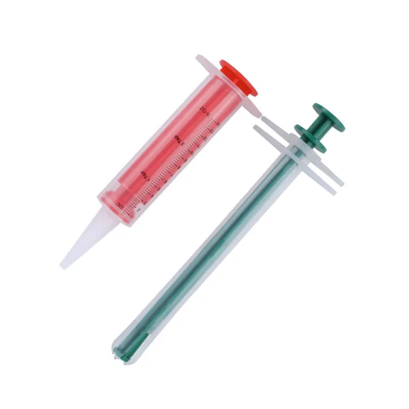Two silicone pet pill shooter tools with soft tips for administering medication to cats and dogs.