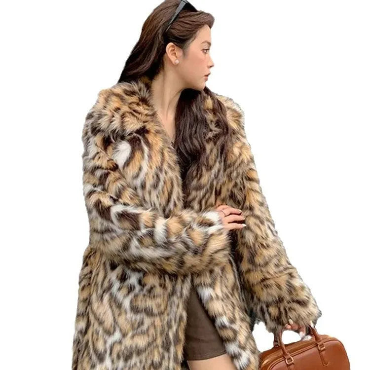 Faux fur coat with fur collar in long or mid-length style showing pocket details