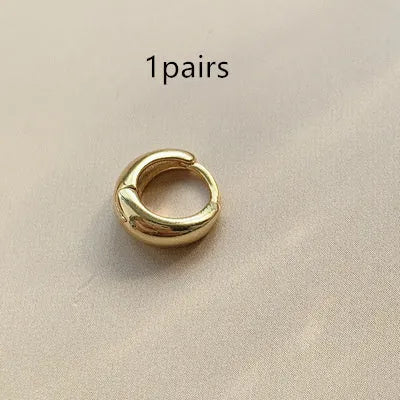 Women's retro minimalist geometric water drop earrings in gold and silver, shown in large, medium, and small sizes.