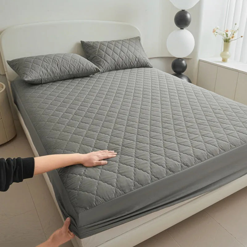 Diamond lattice quilted bamboo fibre mattress protector fitted sheet and pillowcases in solid colour.