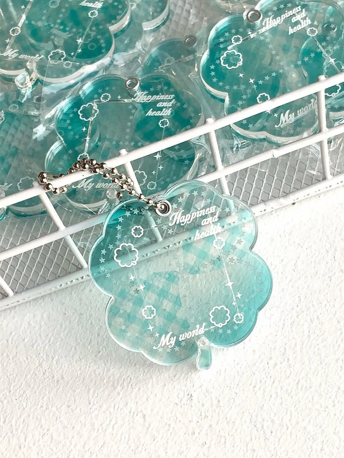 Acrylic four-leaf clover pendant keychain in elegant blue, grass green, or mint green.