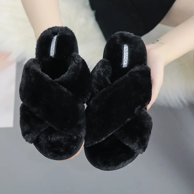 Women's cross open-toe fur slippers in black showing non-slip sole pattern