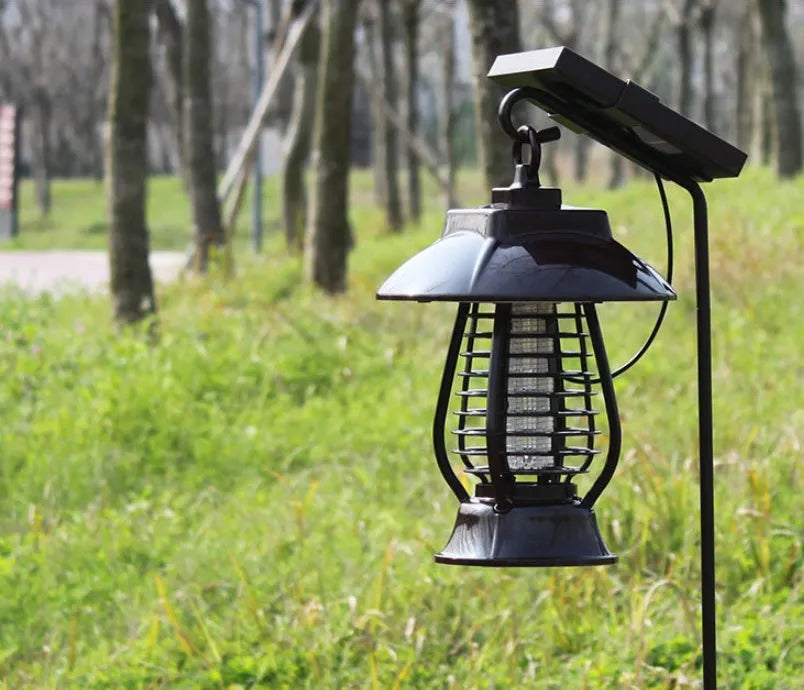 White solar powered outdoor mosquito repellent lamp with solar panel on top and LED light beads.