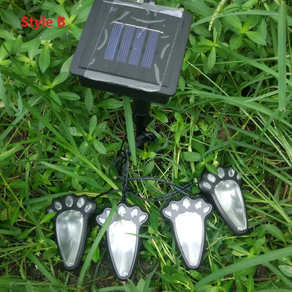 Black bear paw-shaped solar garden lights with solar panel pole for outdoor pathway illumination