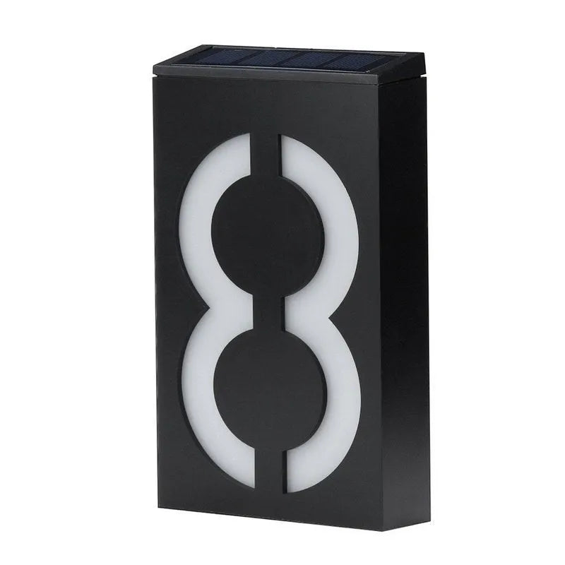 Solar powered white LED house number light mounted on a wall with IP65 waterproof rating