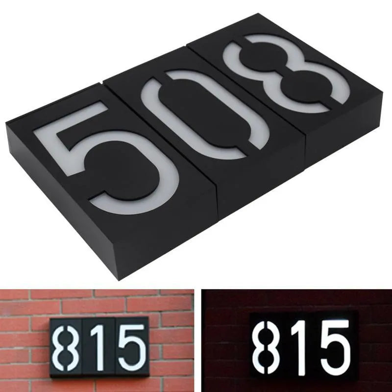 Solar powered white LED house number light mounted on a wall with IP65 waterproof rating