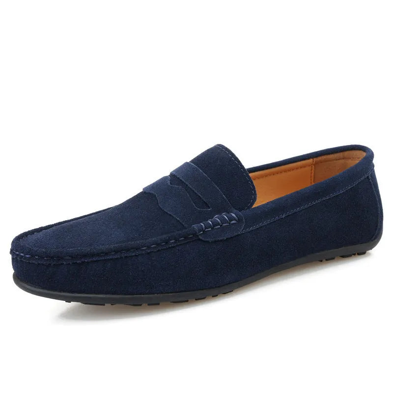 Men's solid colour suede leather slip-on loafers with a flat rubber sole.