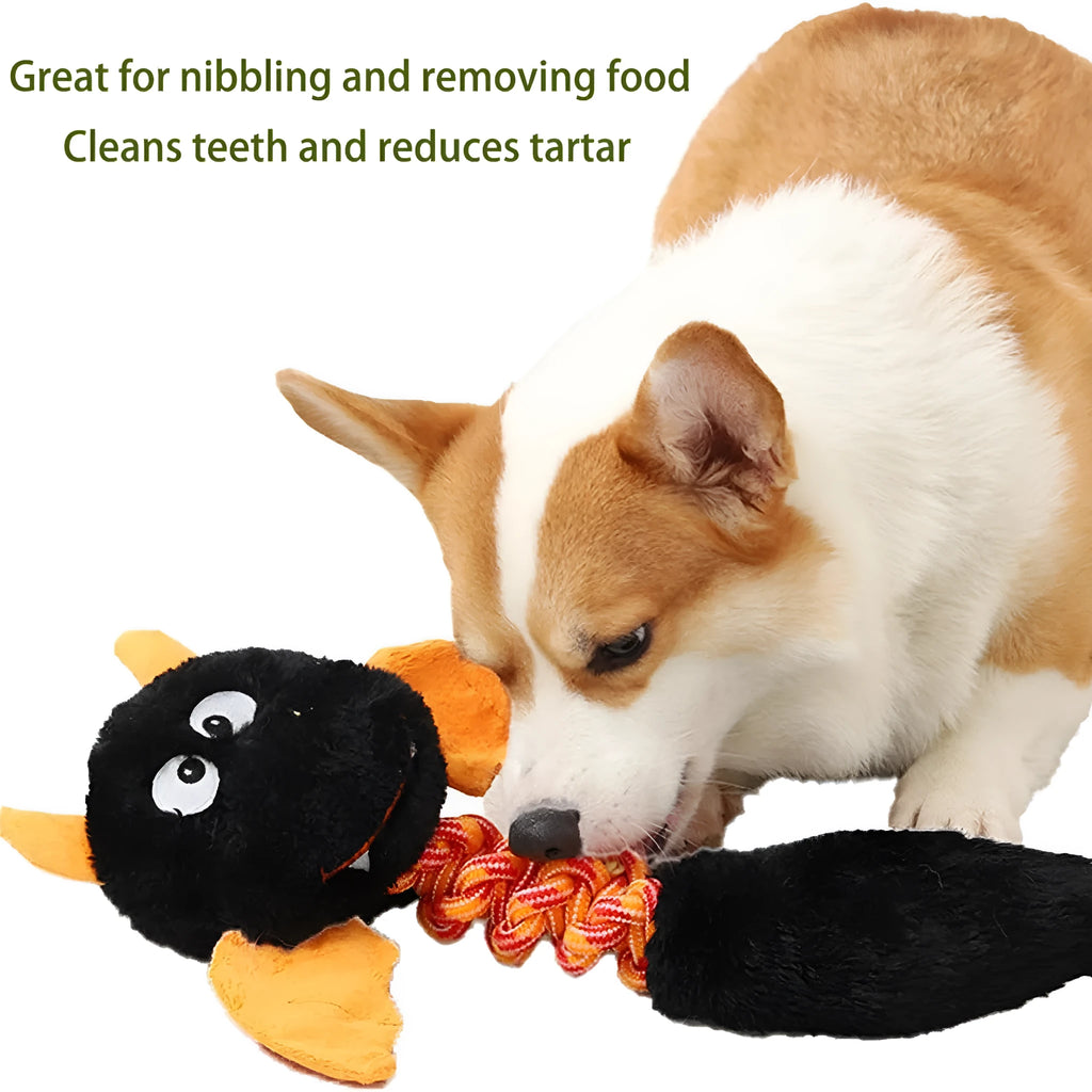Large black plush dog toy with cartoon design, a rope knot, and a squeaker for chew play.