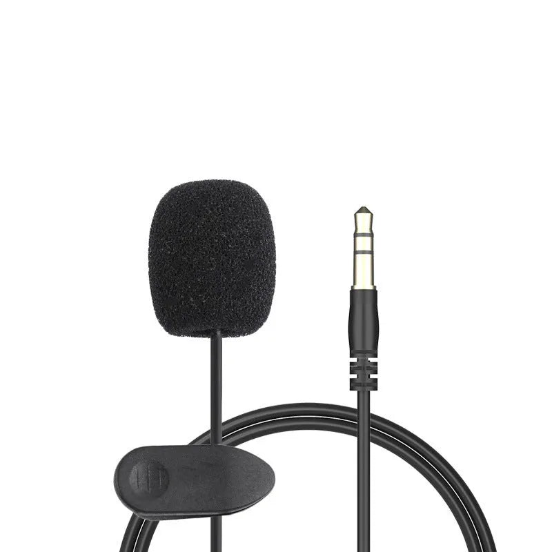 White lavalier lapel clip microphone with long cable and in-ear earpieces next to an iPhone.