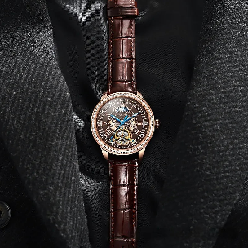 Men's stainless steel mechanical watch with transparent case back showing movement and butterfly buckle