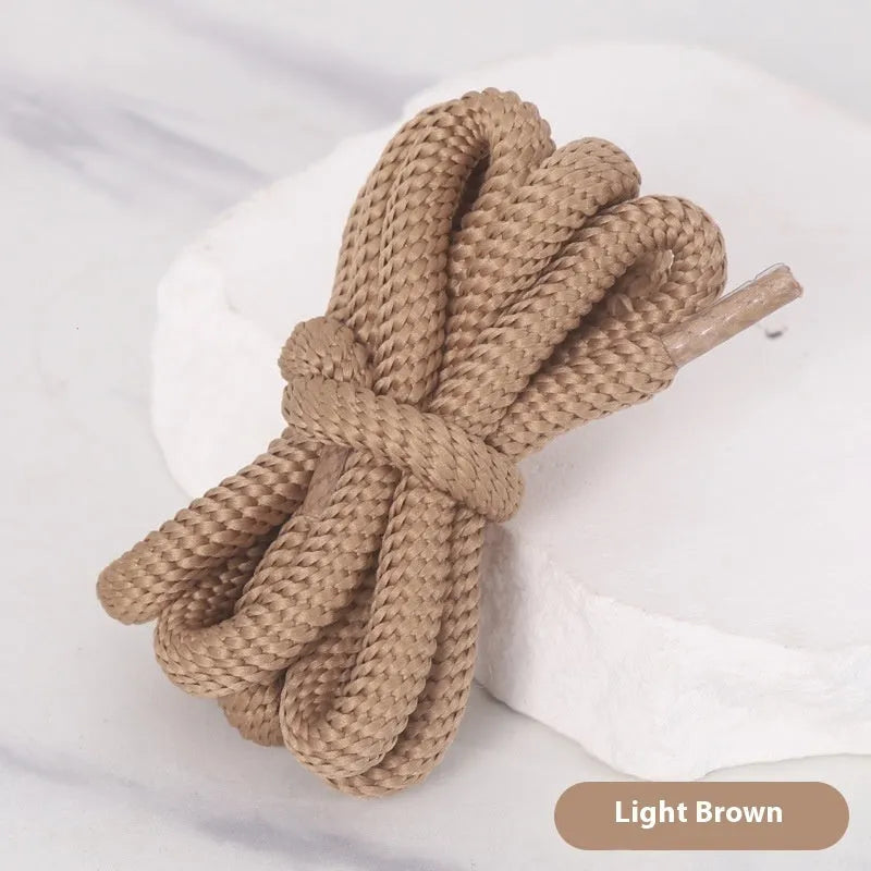 A selection of round braided shoelaces and hoodie cords in various colours, showing 1.0cm width