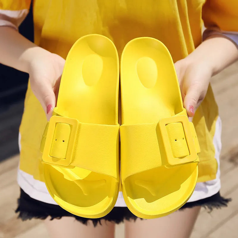 Women's grey blue EVA flip-flops with a buckle strap on a soft sole.