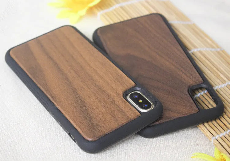Wooden hybrid phone case with a carbonised bamboo back and black TPU bumper for iPhone.