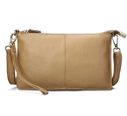 Lady cowhide slant bag in apricot showing top layer leather texture and dual straps
