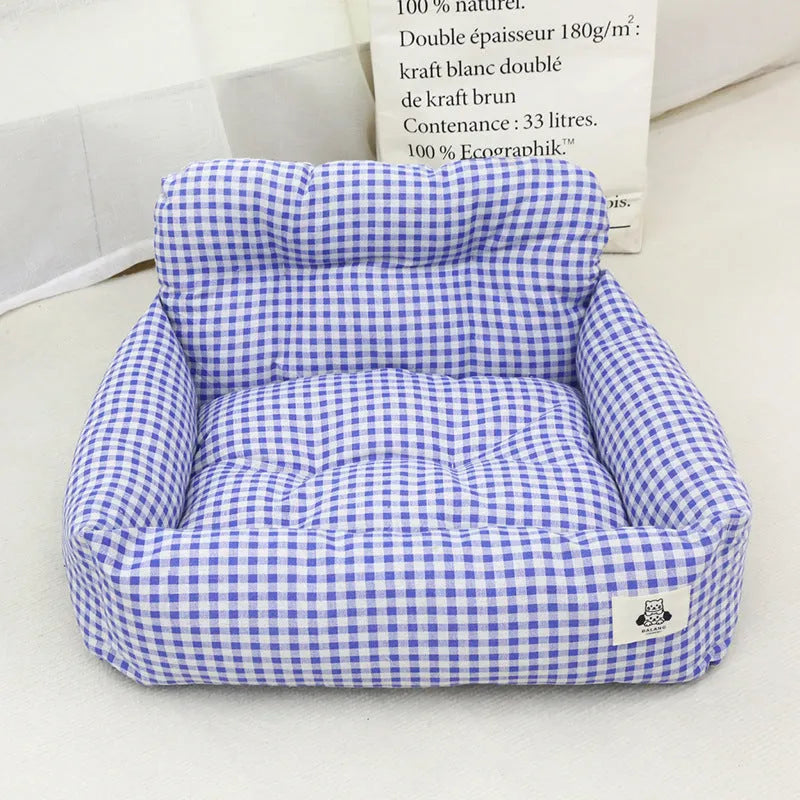 Blue plaid and grey car-mounted pet travel nests in two sizes for small to medium dogs