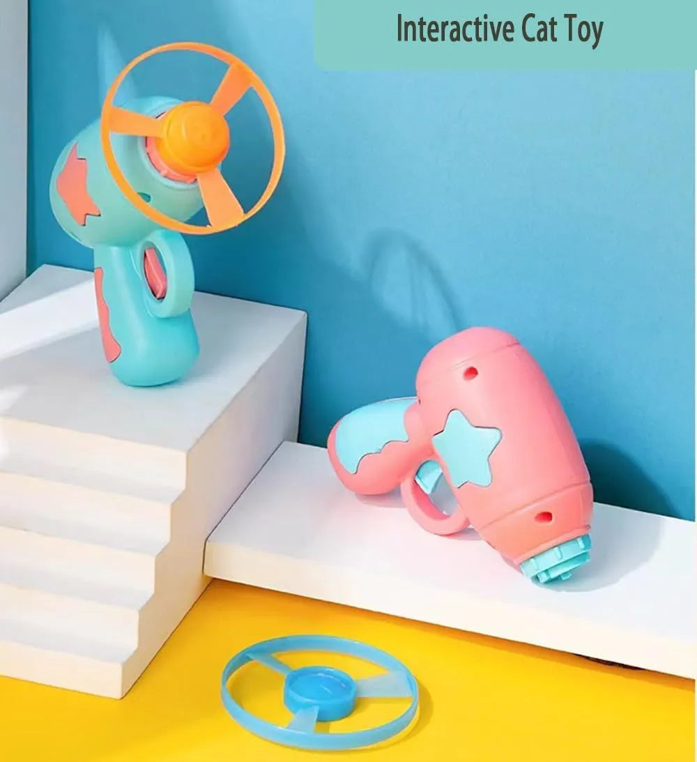 Blue or pink plastic cat toy gun with frisbee launcher for indoor feline play