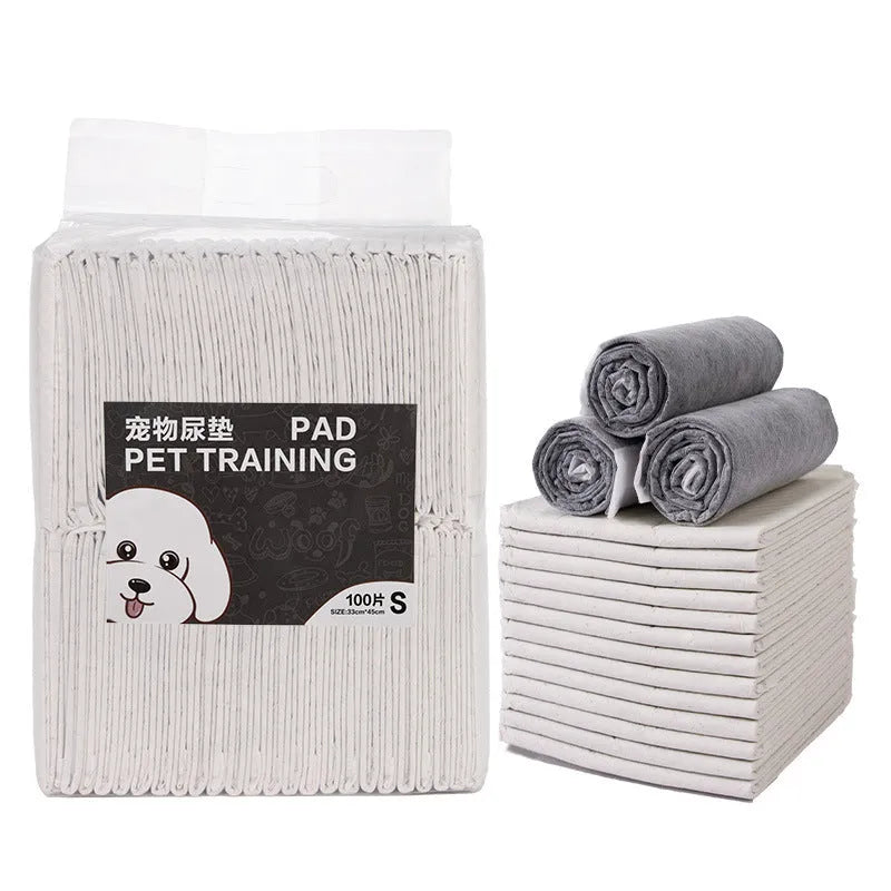 Pack of disposable pet urinal pads showing bamboo charcoal and standard models in S, M, L, XL sizes