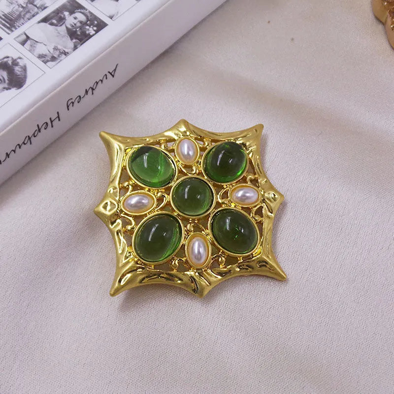 Close-up of a vintage zinc alloy baroque cross brooch with crystals, showing one of eight available colour styles.