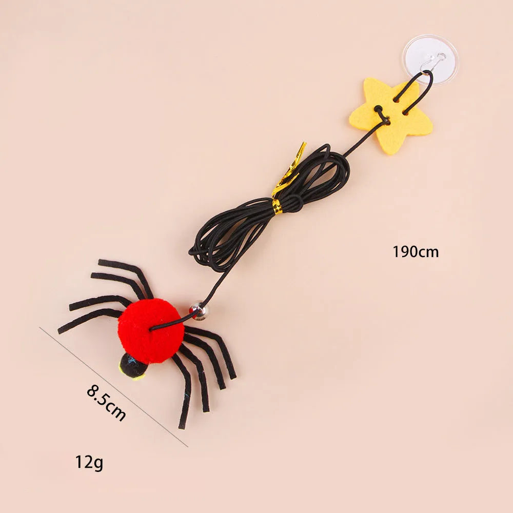 Cat hanging door toy with elastic rope, feather, bell and spider attachment in red colour
