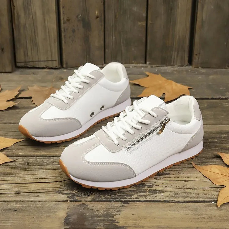 Women's flat-heeled casual shoes in champagne, grey, and white colours with artificial PU upper.