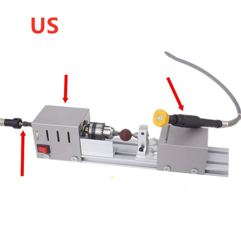 Mini silver metal woodworking lathe with carving knives on benchtop for small-scale turning projects