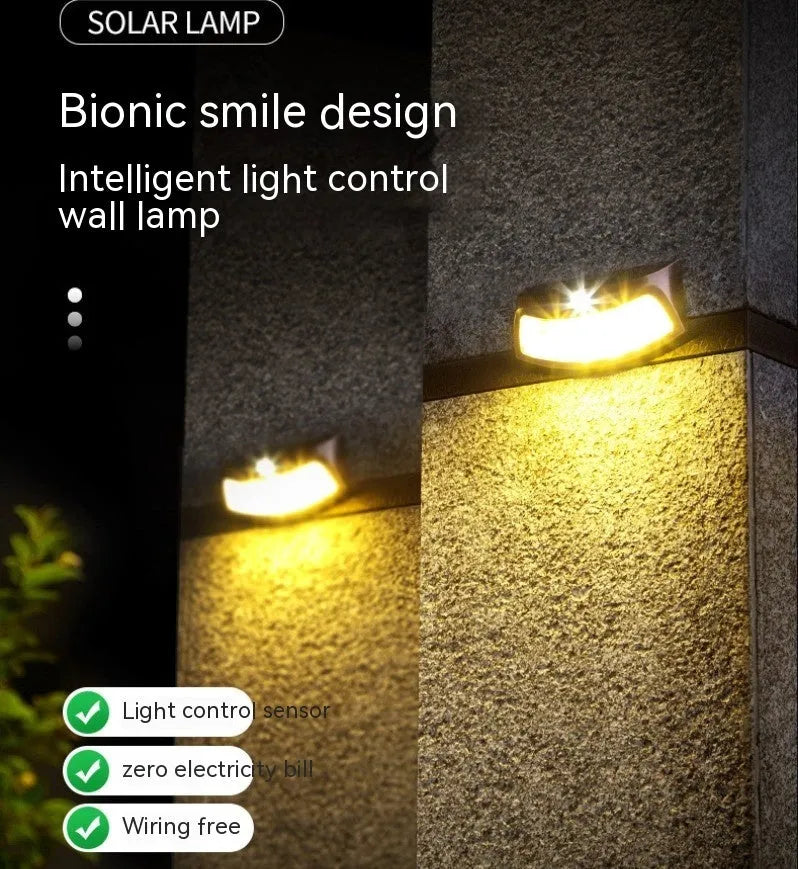 Solar-powered smiling face garden wall light with IP65 weather protection for outdoor courtyard and villa lighting