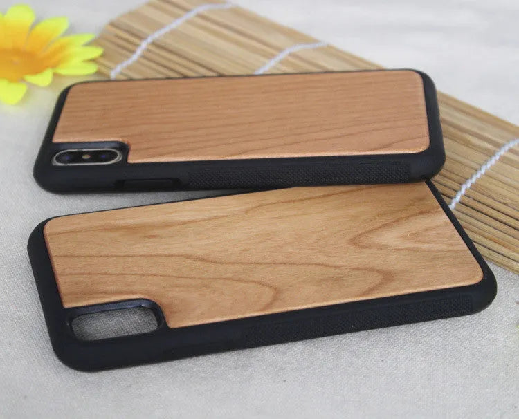 Wooden hybrid phone case with a carbonised bamboo back and black TPU bumper for iPhone.