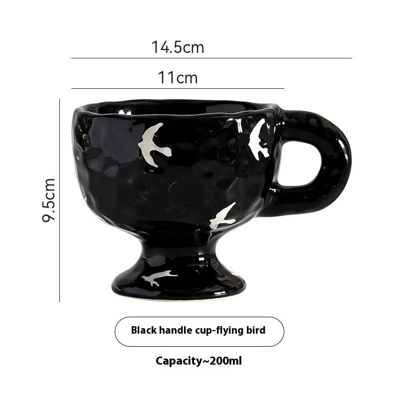 Hand-pinched irregular ceramic mug in solid colour with modern simple design