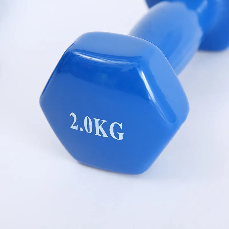 Bright coloured plastic dumbbells in 0.5kg, 1kg and 1.5kg sizes for home fitness with glossy surface