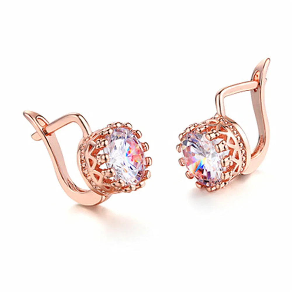A pair of crown-shaped clip-on earrings for women in a rose gold or white gold colour finish.