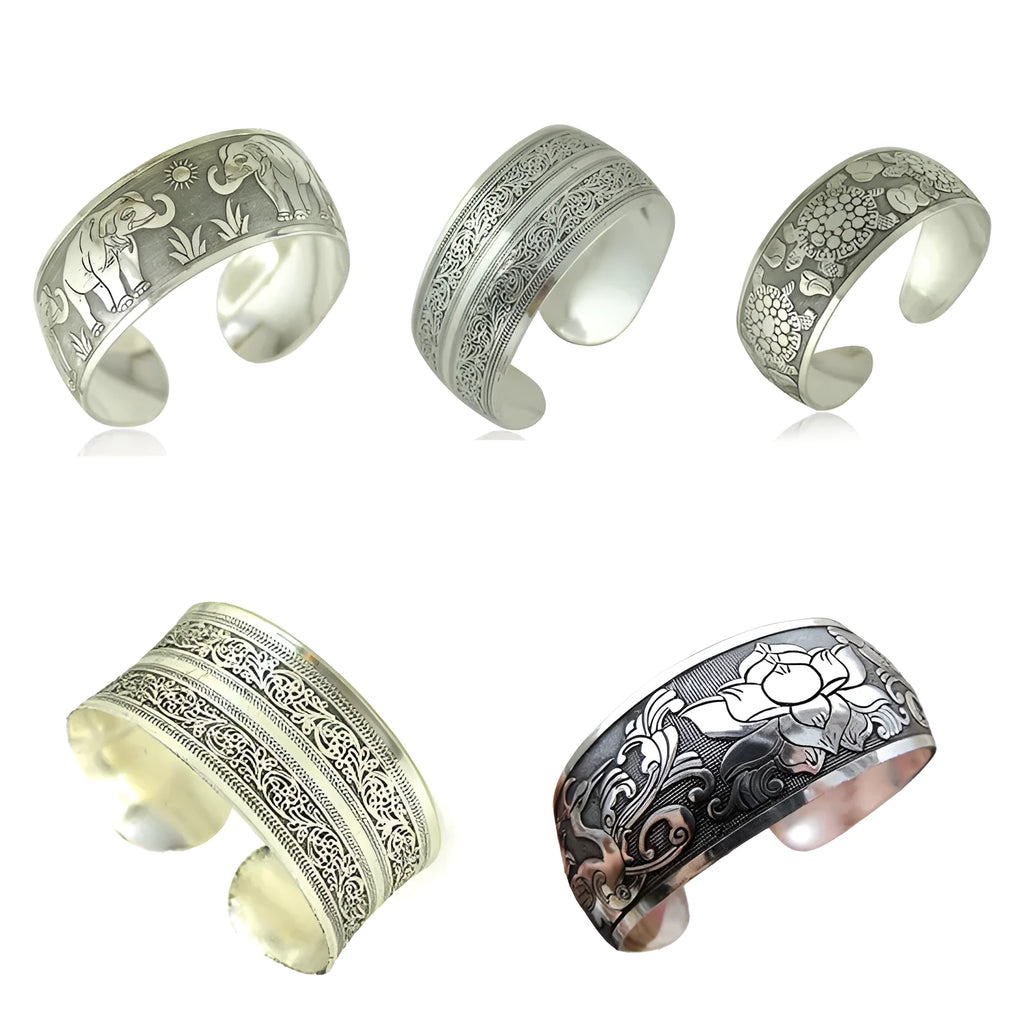 Openwork Miao ethnic carved silver bracelet with elephant or turtle motifs