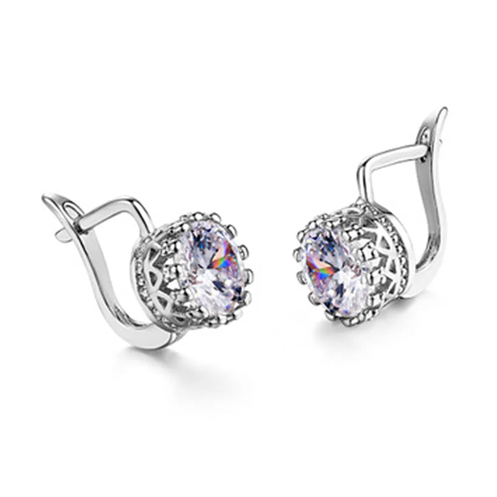 A pair of crown-shaped clip-on earrings for women in a rose gold or white gold colour finish.