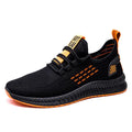 Men's black casual trainers with cross-strap design over striped pattern and Flying Weave fabric upper