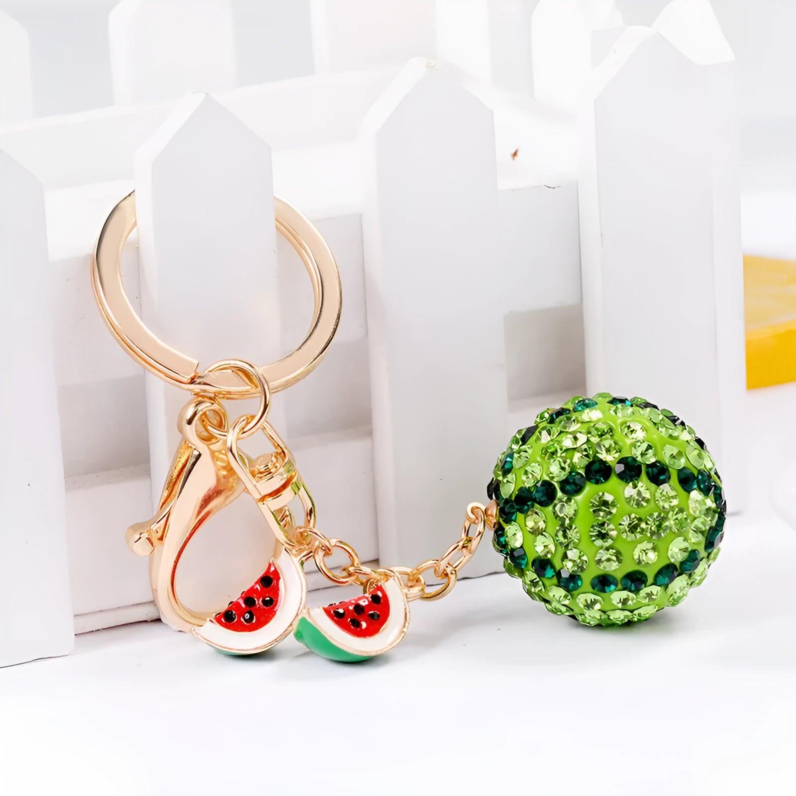 Green watermelon shaped zinc alloy keychain measuring 12cm