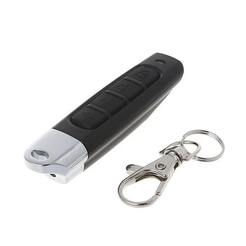 A compact black rolling door remote control measuring 6.7cm, showing buttons for copying and operation.