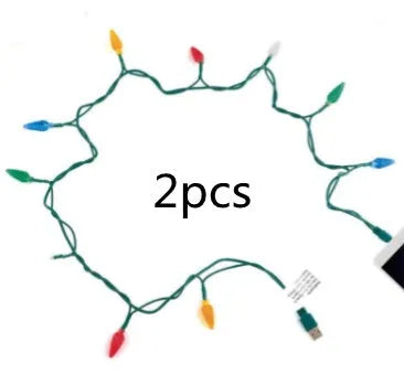 Green USB charging cable with 10 small LED lights illuminated along its length for festive decoration.