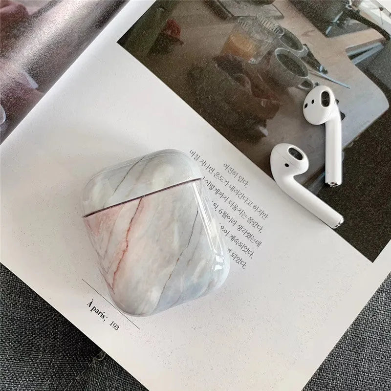 White Marble hard PC protective case fitted on an AirPods wireless charging case.