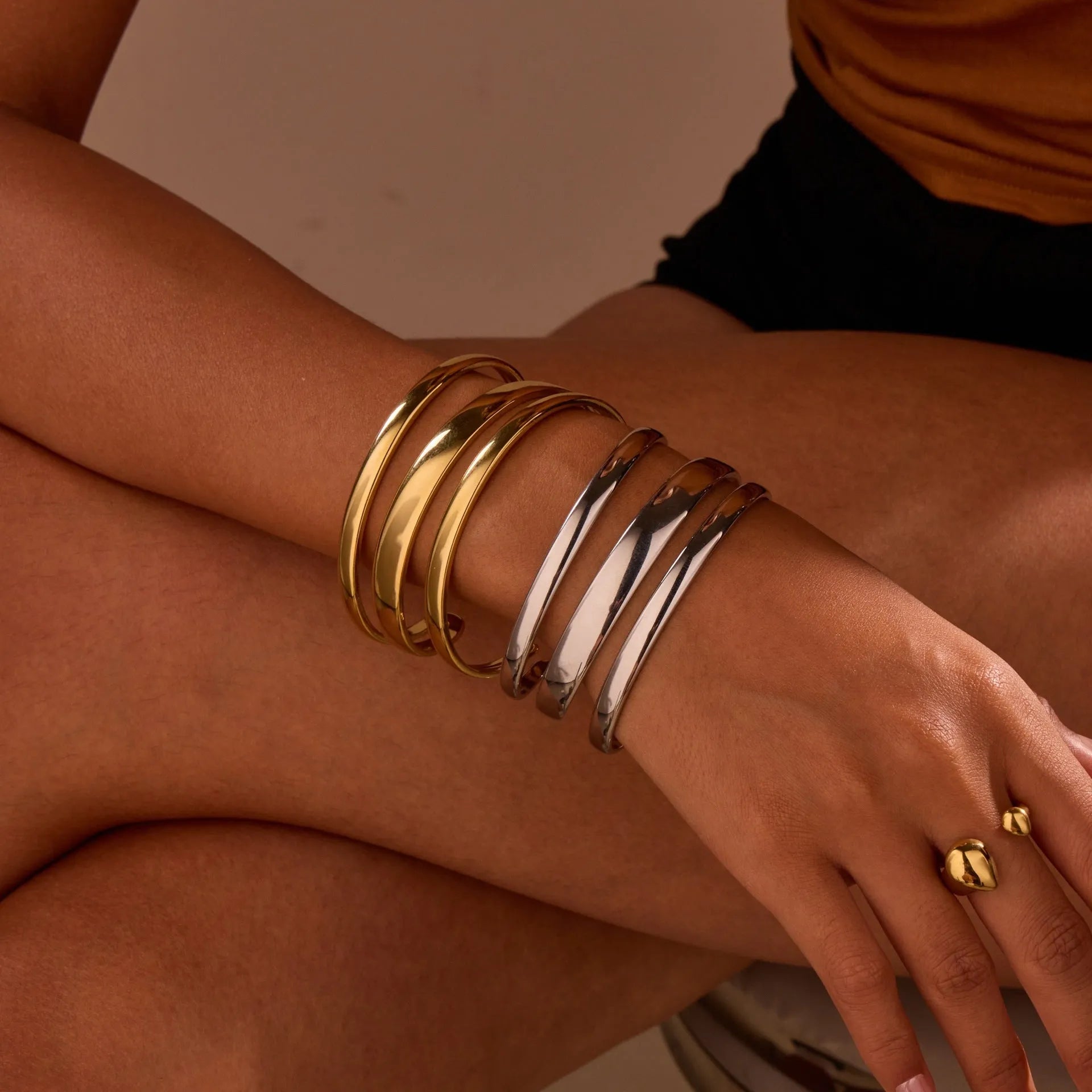 Stainless steel geometric line bracelet with simple opening clasp in gold or steel finish