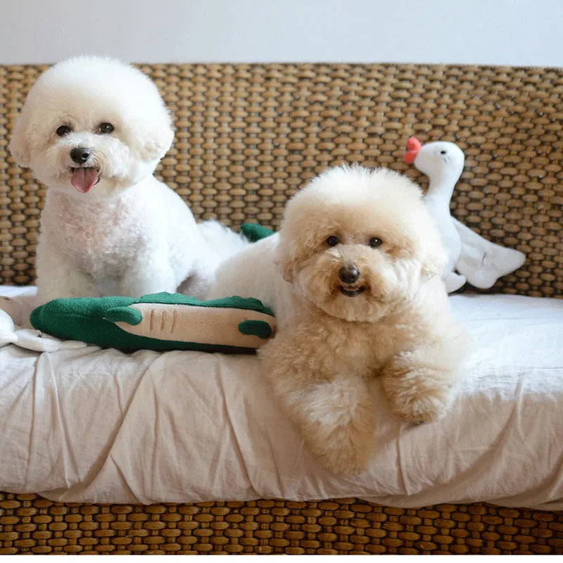 Green plush toy dog with soft fabric and beanbag weight for stability