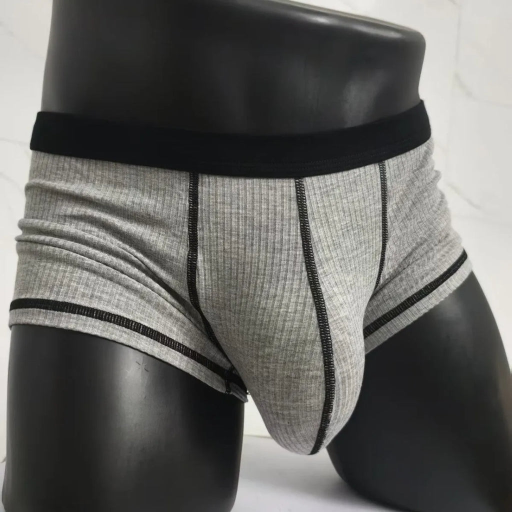 Men's solid colour boxer shorts on a white background, showing thin breathable fabric.