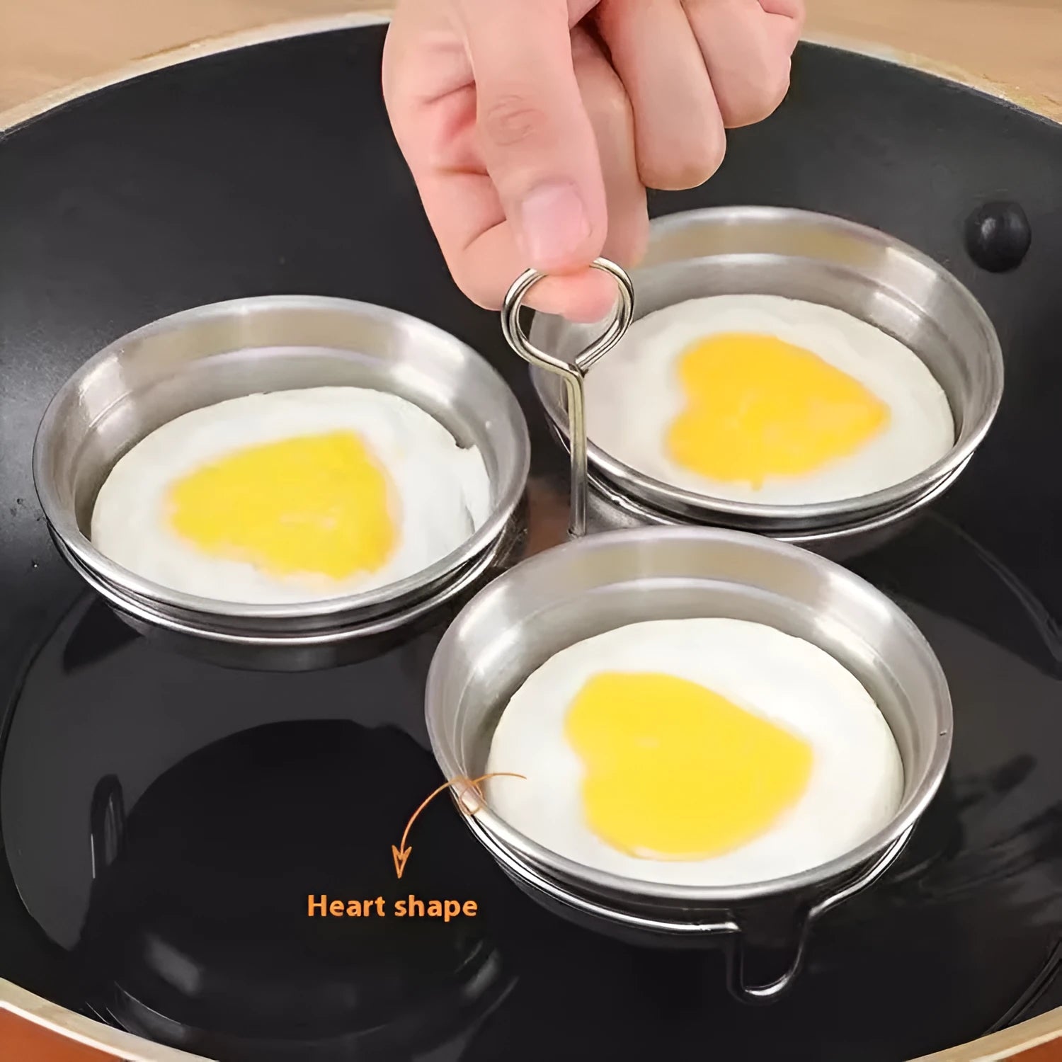Heart-shaped stainless steel mini egg steamer for cooking individual eggs on stovetop