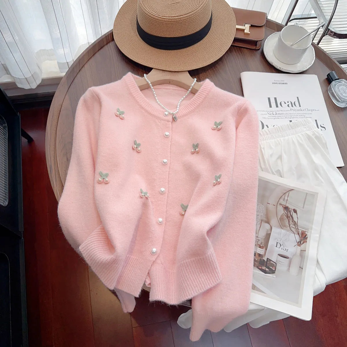 Soft pink French sweet style cardigan coat with beaded details and a round neckline.