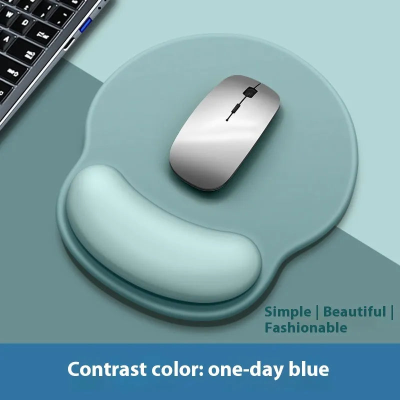Silicone mouse mat with wrist rest in gradient colour pattern on desk