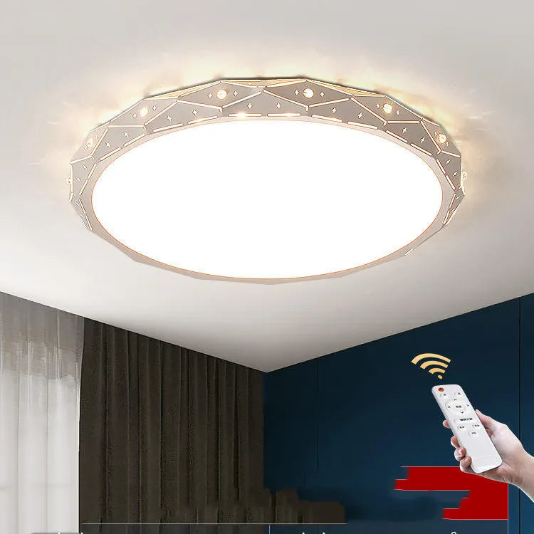 Round black and white framed LED ceiling light fixture for room installation.
