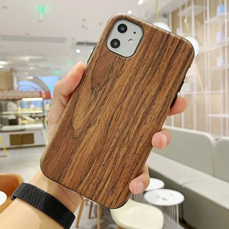 Wooden iPhone back cover case in rosewood finish showing precise cutouts for camera and ports.