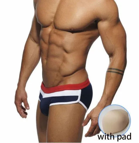 Men's nylon patchwork swim trunks in black, dark blue, and pink, available in sizes M to XXL