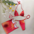 Tie-dye pattern three-piece halter bikini swimsuit set on a mannequin.